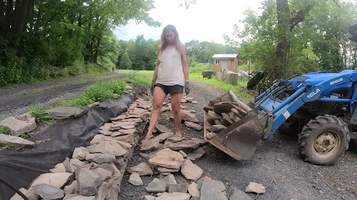Mrs W building a stone wall and finishing the lowe...