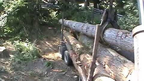 Self Loading Logging Truck at work