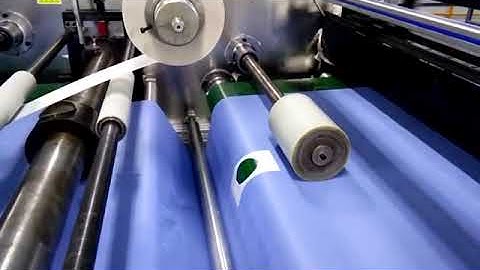 Surgical Drape with reinforcement and tape auto making and folding machine