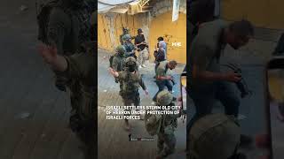 Israeli settlers storm Hebron's Old City under protection of Israeli forces