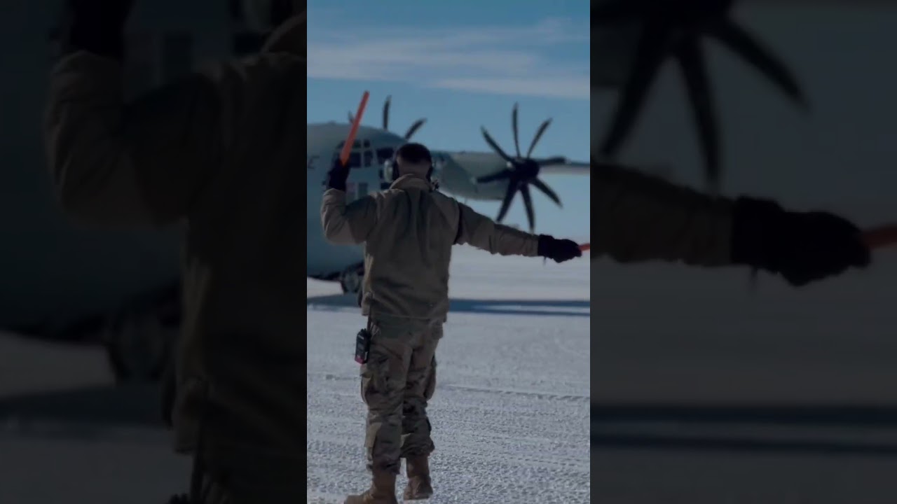 Airman marshaling out LC-130 in Antarctica 