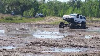 Nissan Xterra mega truck goes deep @ Woodpecker mud bog April 2024