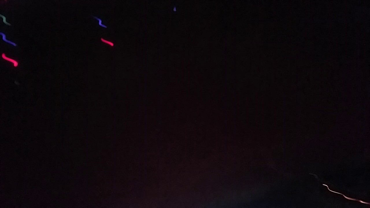 Spinning under the trail of lights tree