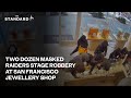 Moment two dozen masked raiders armed with pick axes stage robbery at San Francisco jewellery shop