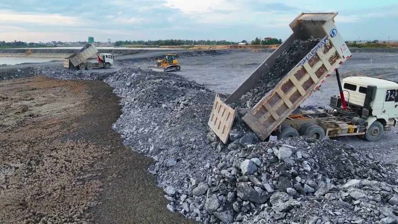 EP04,New development Starting a new road project with a dump truck being pushed by proficient dozer