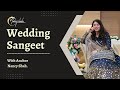 Anchor nancy shah hosting a gujarati wedding sangeet