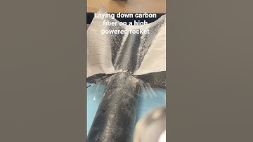 Putting carbon fiber on rocket fins.