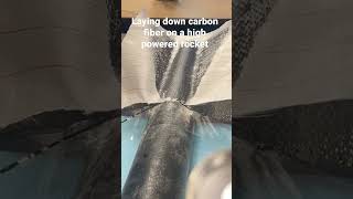 Putting carbon fiber on rocket fins.