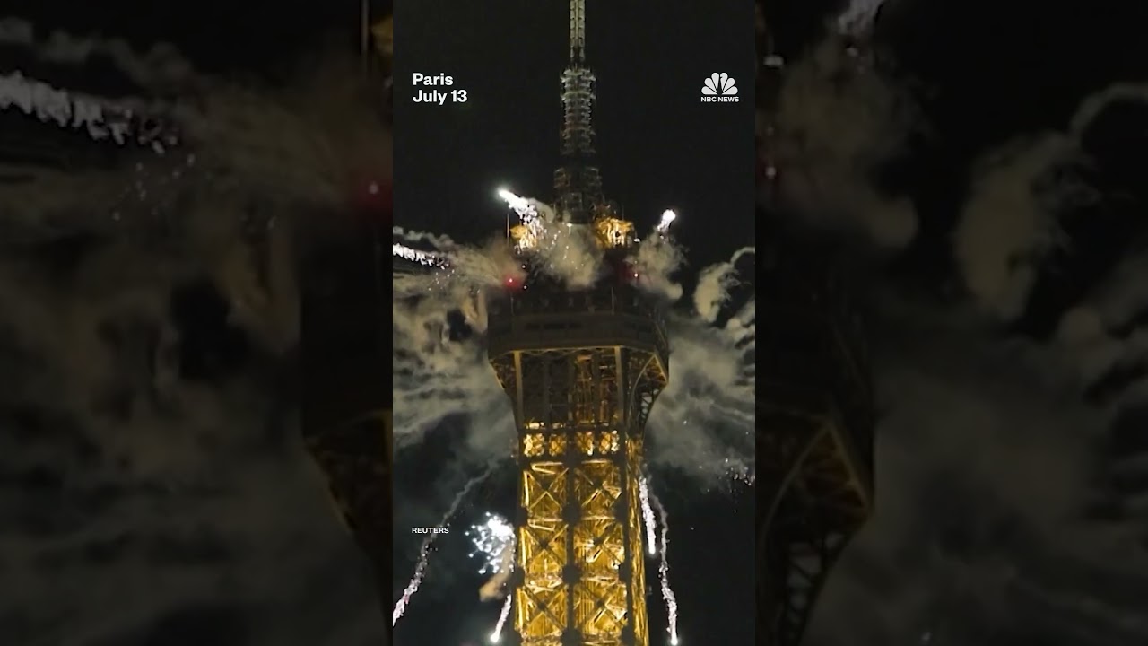 A fireworks display illuminates the Eiffel Tower to mark Bastille Day celebrations