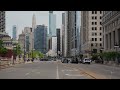 Handheld scene of Downtown Chicago capturing daily life with traffic flowing between architectural