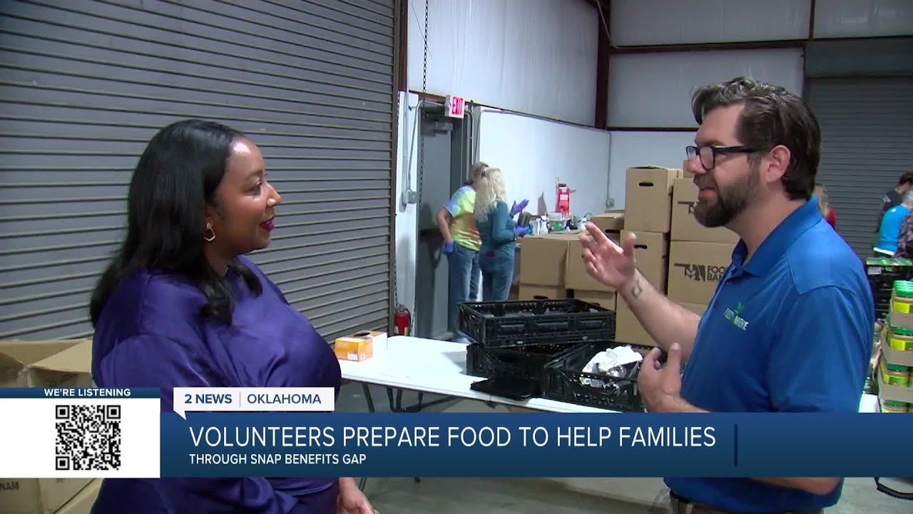 Food on the Move volunteers prepare food bags to help families during SNAP lapse