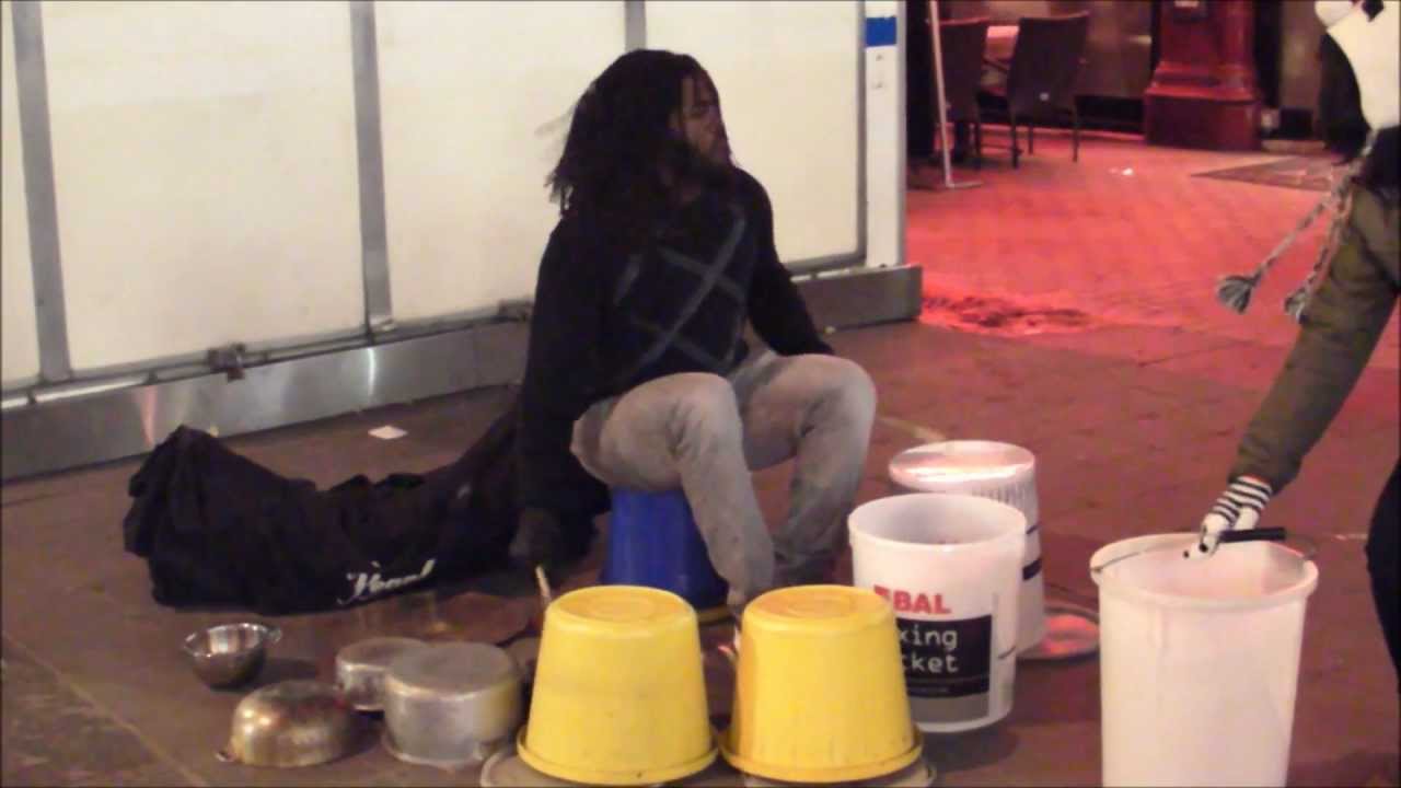 Street Drummer Playing Buckets, Pots and Pans. London Street Music