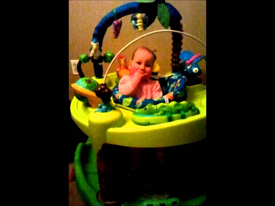 Baby in safari exersaucer banging her legs YouTube