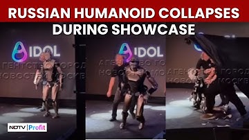 WATCH: Russian Humanoid Falls Face First On Stage, Staff Tries To Cover It With Black Curtains