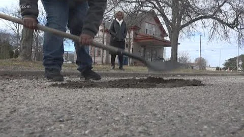 Muskegon Heights boy fills potholes on his street