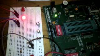 Toggling two LEDs by using MICROCONTROLLER PIC16F690