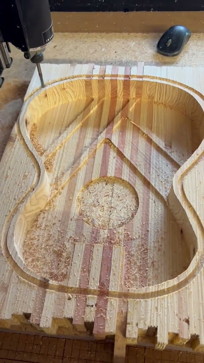 Parlor acoustic guitar made from salvaged pine from a pallet