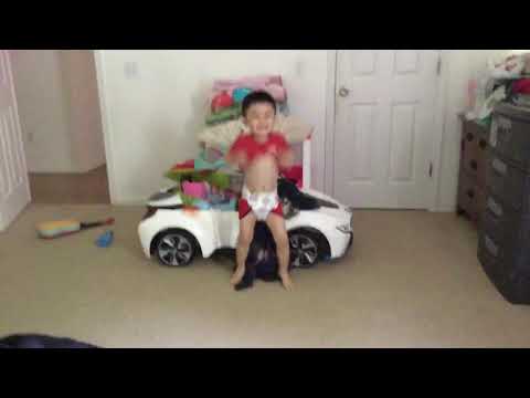 Three year old kid dancing with a diaper