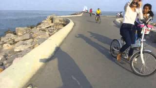 Cycling by the Cha-am pier