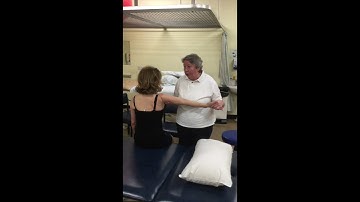 Sit to supine facilitation; Actively following the reaching arm