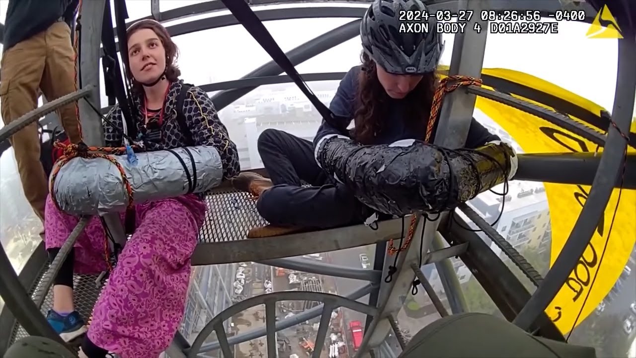 Protesters Use ‘Sleeping Dragon’ Device to Lock Themselves to Crane ...