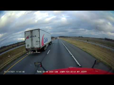 step deck driver is dragging a piece of dunnage on the road
