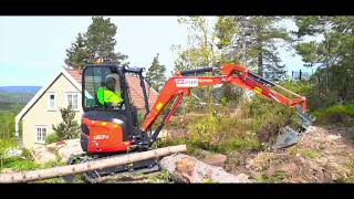 Kubota U 27 4 excavating backyard of a house