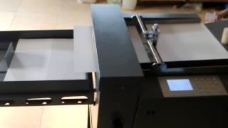 Auto creasing machine with air suction feeder