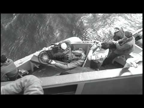 USS Larson fires at Japanese submarine I-402 which sinks. HD Stock Footage