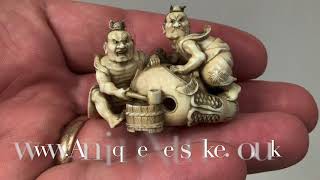 Antique Meiji period Netsuke with two Nio polishing a mokogyu, signed Tomomasa.