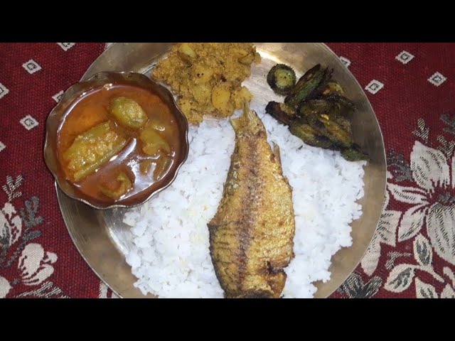 EATING RICE WITH KANGRUL FRY, FISH EGG ALUU POSTO, FISH FRY WITH EXTRA GRAVY class=