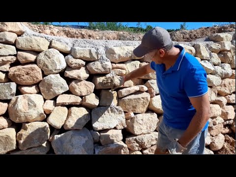 Vídeo: Com puc construir un mur de contenció de roca seca?