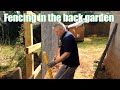 Erecting the posts and rails and installing feather edge fencing - B roll video