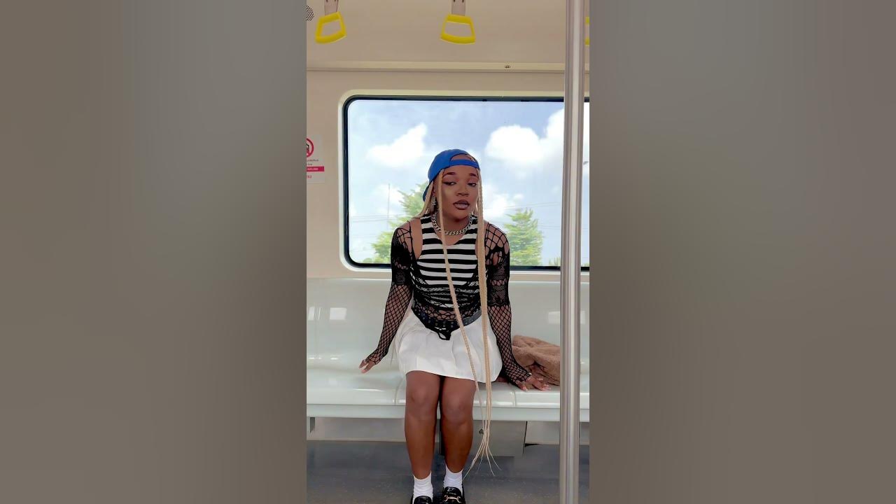Treazure exploring train transportation in Lagos, Nigeria while sampling her new song titled Ayé