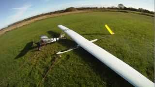 Funcub towing a 4,85 meter glider.