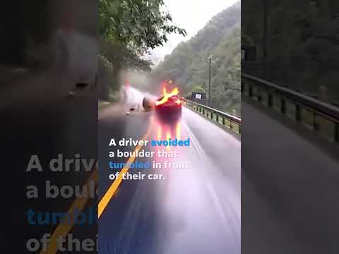 Quick-thinking driver swerves to avoid boulder plummeting onto road #Shorts