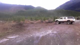 HUGE 1996 Lifted suburban in mud