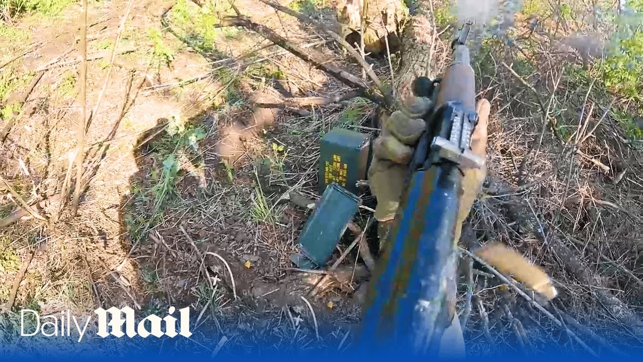Ukrainian soldiers ambush Russian positions from armoured vehicle near Bakhmut in POV footage
