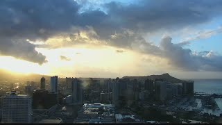 Light trade winds, with approaching cold front to bring increase in showers