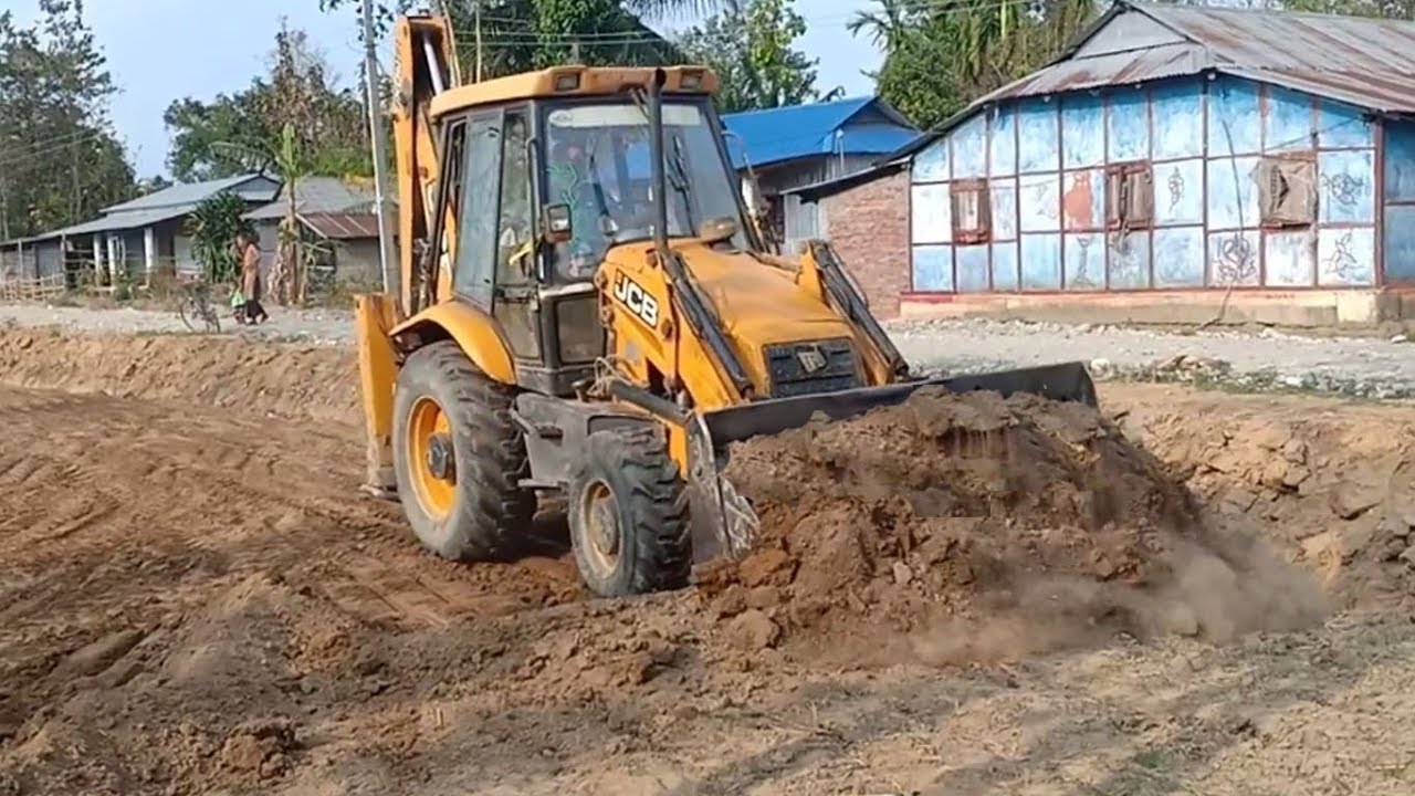 old-jcb-backhoe-felling-big-trees-and-leveling-dusty-ground-youtube