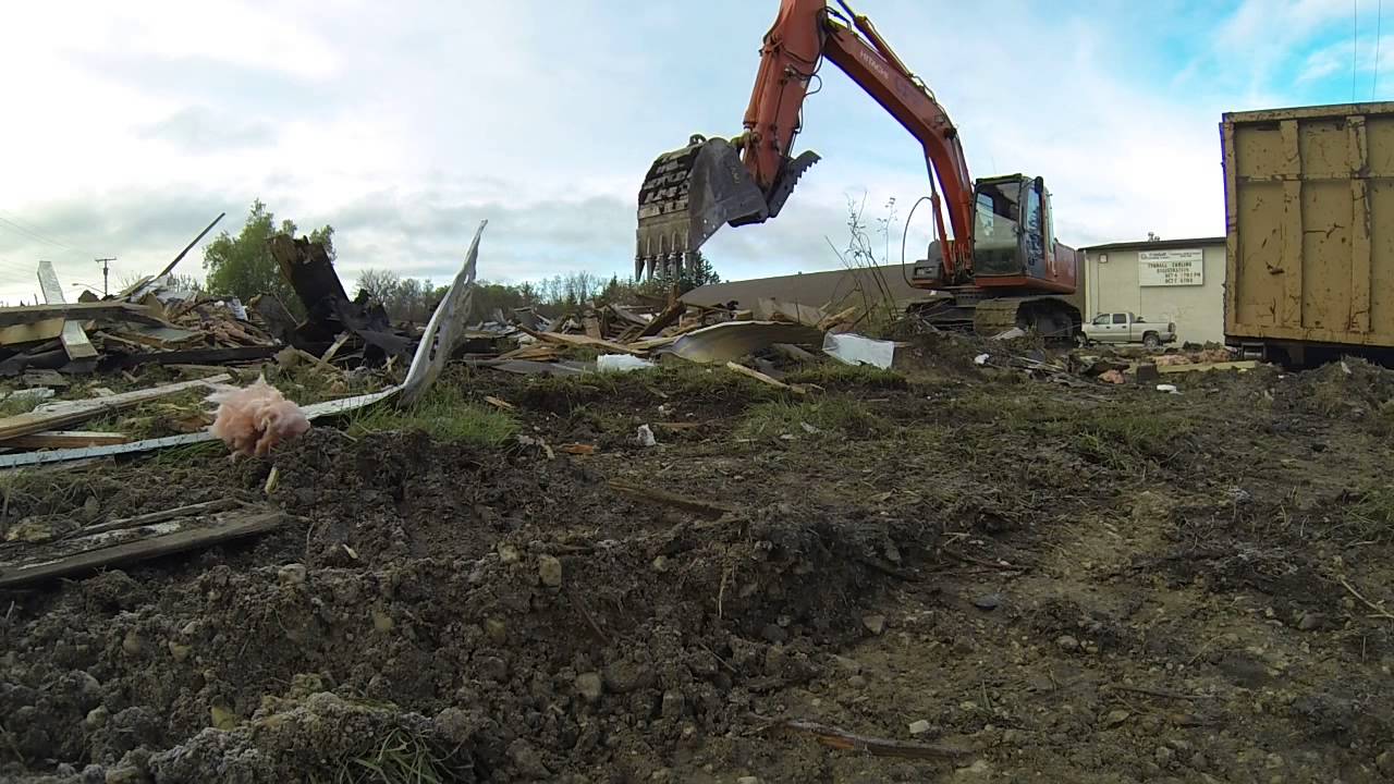 Crunching up demo debris and loading it out