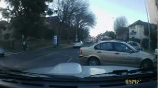 20120807 - Lady blocks traffic with BMW
