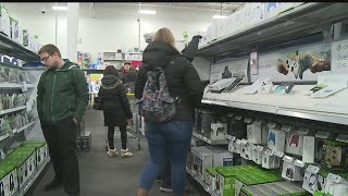 Black Friday shoppers get started as crowds begin to fill stores