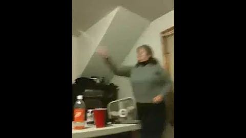 Debbie Crane playing beer pong