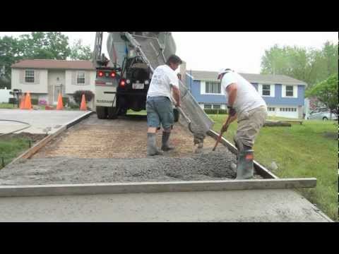 Video: Hoe graaf je een betonnen oprit op?