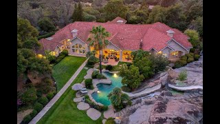 Private 10acre estate with over 10,000 sq ft of single level living with resort style backyard!