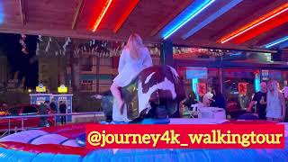 Girl In White Dress Riding On A Bull In Benidorm 4K