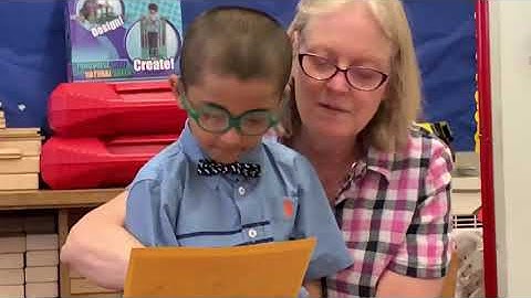 Pre-K kid reading front of class teacher (P.S.213)