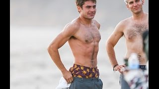 Shirtless Zac Efron shows off his rock hard abs as he cavorts with his director on the set of We Are