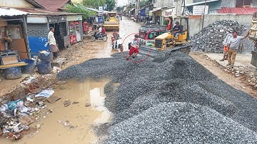 repair broken road in village expert driver Skill bulldozer spreading gravel and  12wheel dump truck